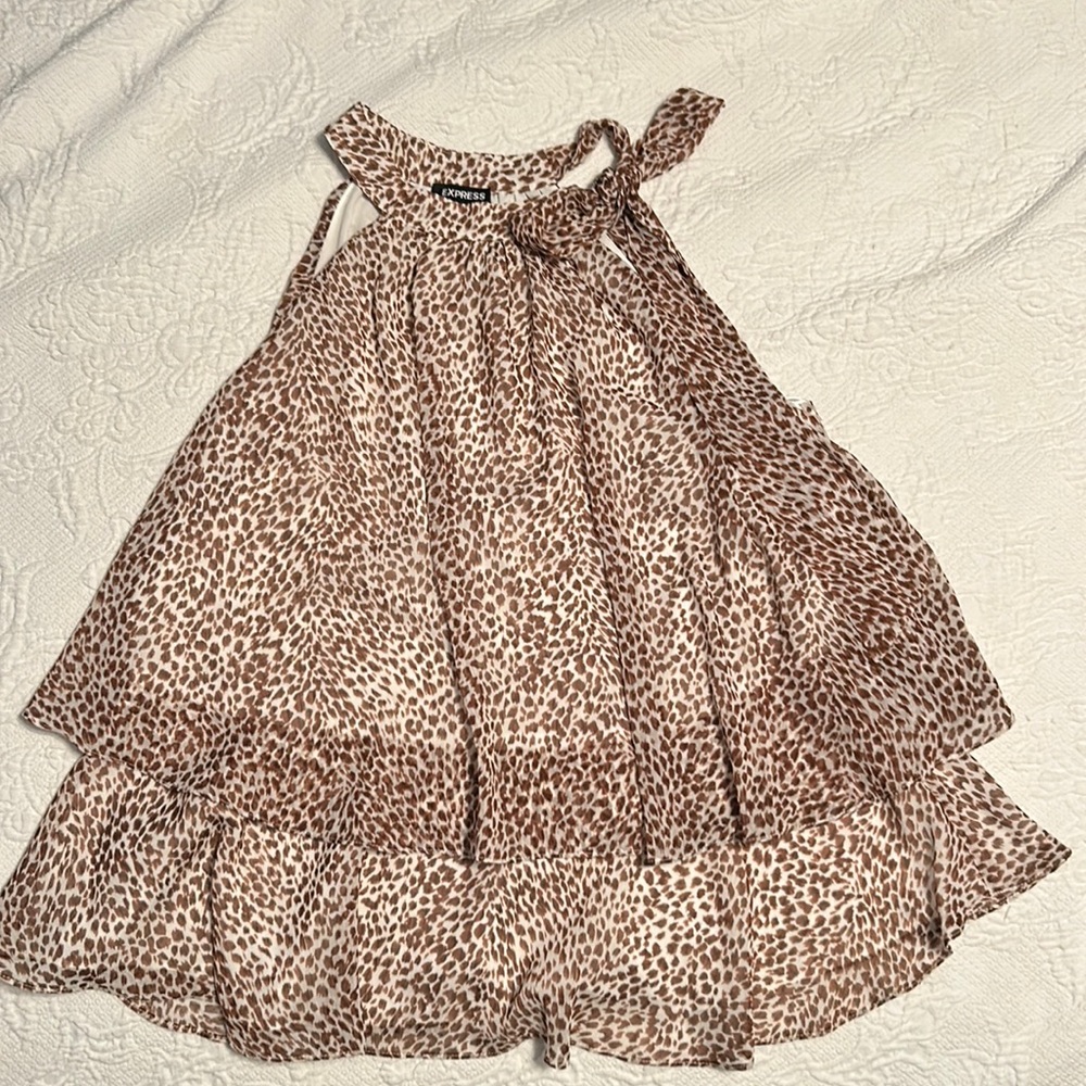 Express Size M.  Blouse that hooks by the neck with a bow.  No sleeves.
